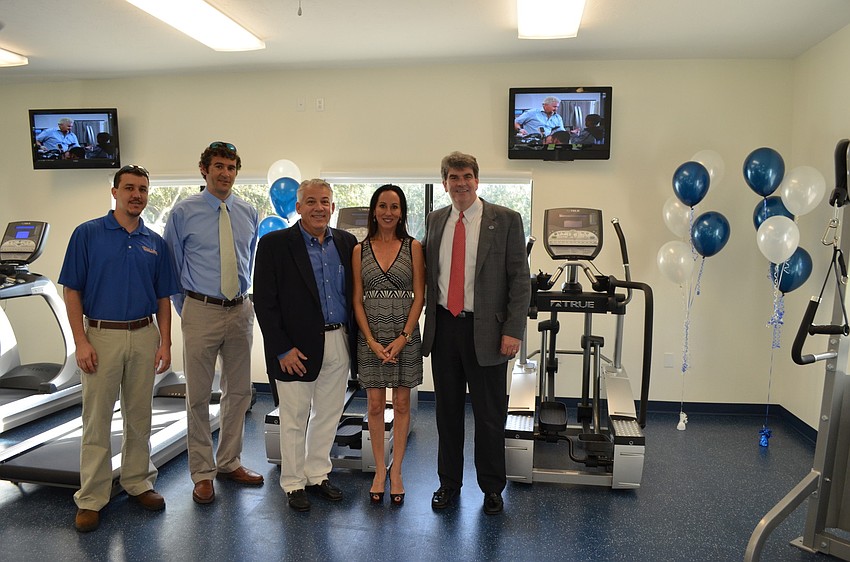Victor Passero and Brad Ellender of Willis A. Smith Construction Inc., with Chairman of the Board of Trustees Mike Vonwaldner, Ashley Kozel, and Head of School David Mahler