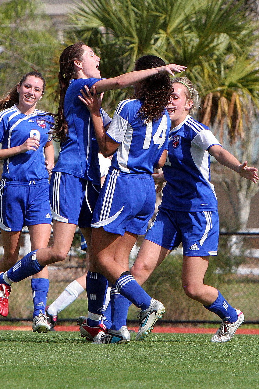Northside Christian celebrate after scoring their first goal of the game.