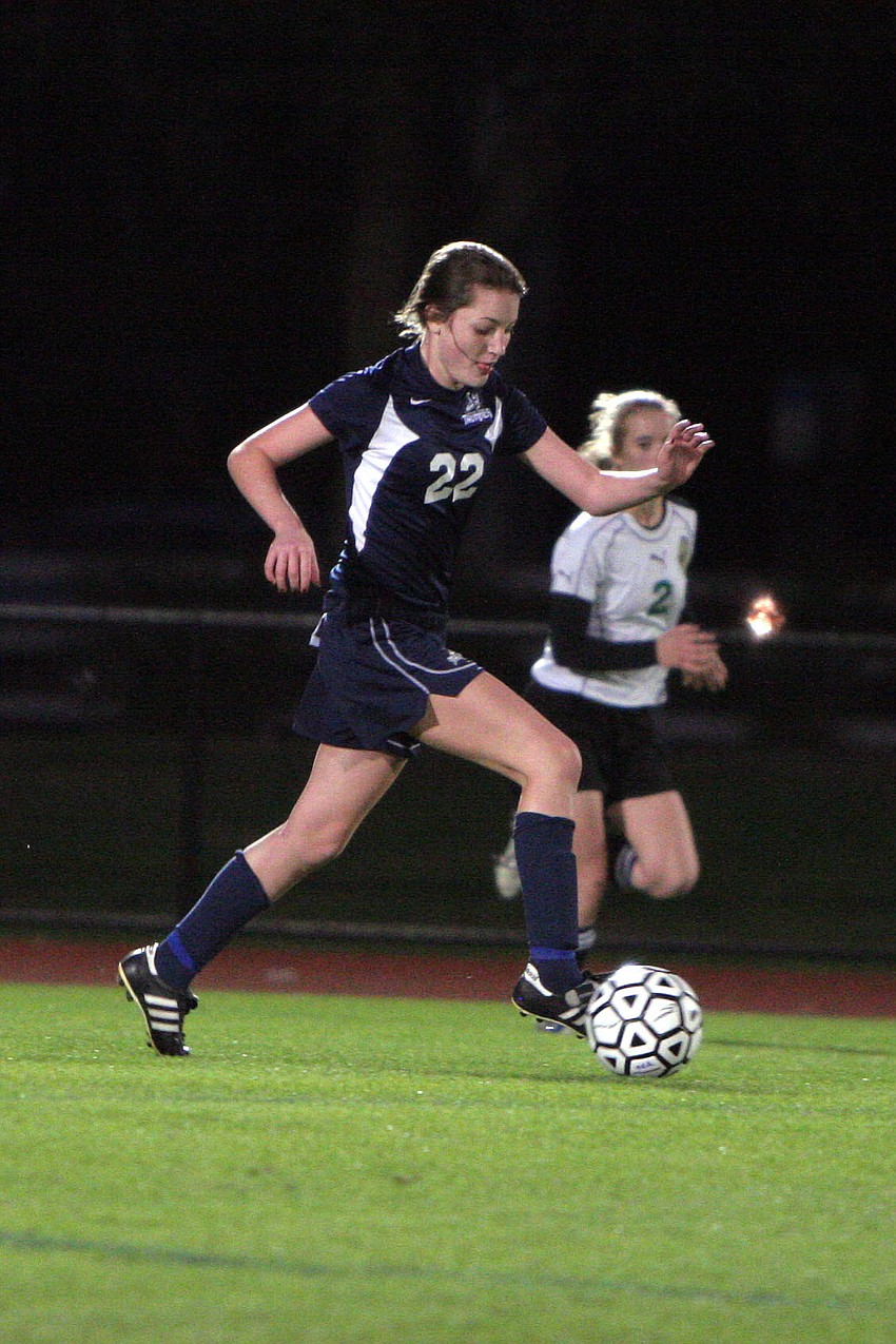 ODAâ€™s Katie Lang, No. 22, kicks the ball down the field.