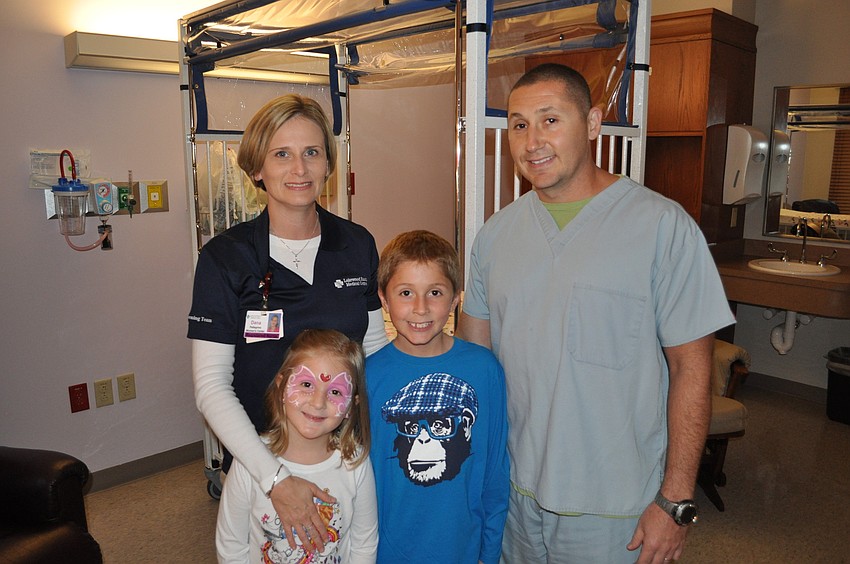 Dana and Danny Pellegrino, both nurses, with their children, Lily and Phillip