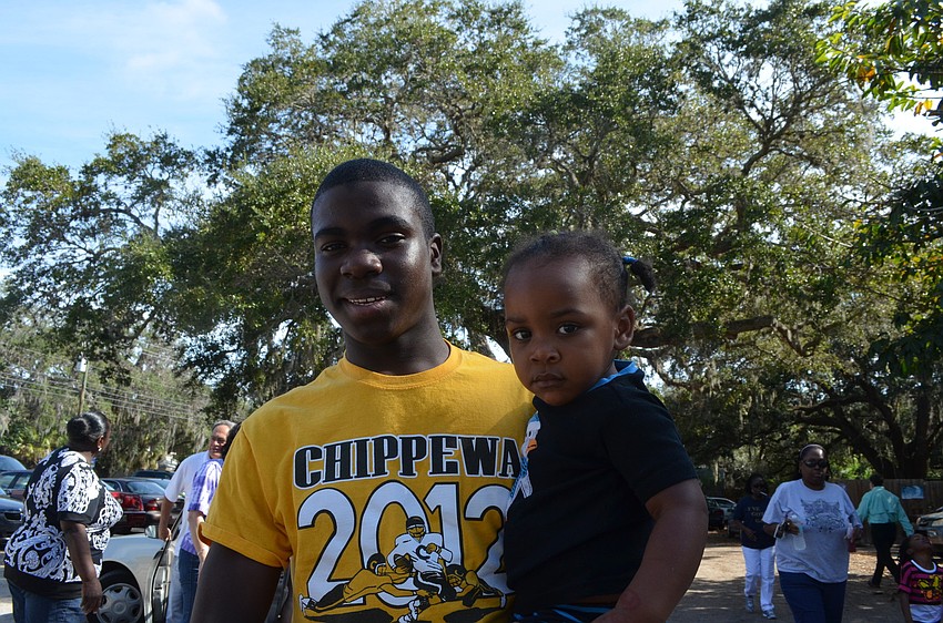 Nahshon Duke, 15, with his little sister Michaela Wesley, 2.