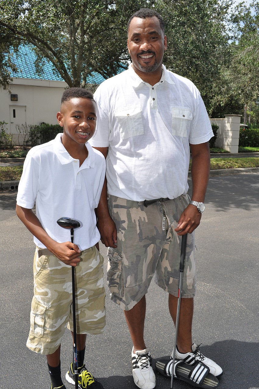 Myles Cowart, 12, golfed with his dad, Marcus.