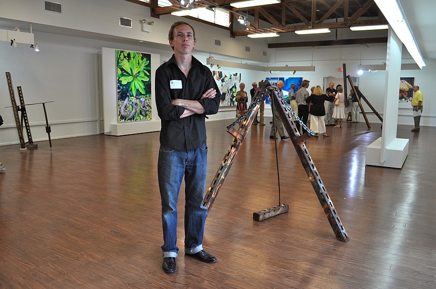 Sculptor Mark Humphrey in front of his work