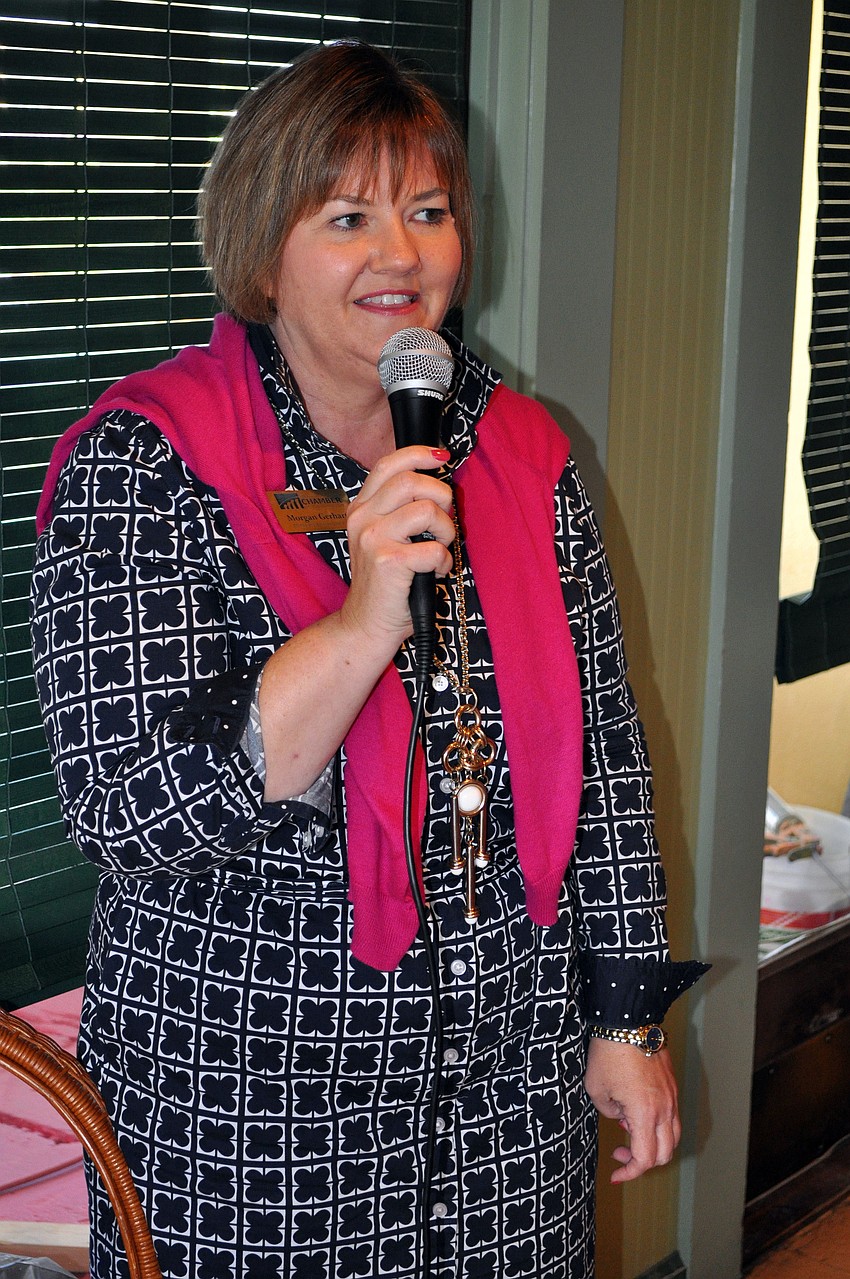 Morgan Gerhart welcomes people to the Power Hour luncheon at Tommy Bahama.