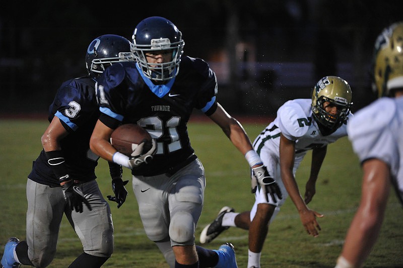 Sophomore running back Austin Hoppe breaks for the outside.