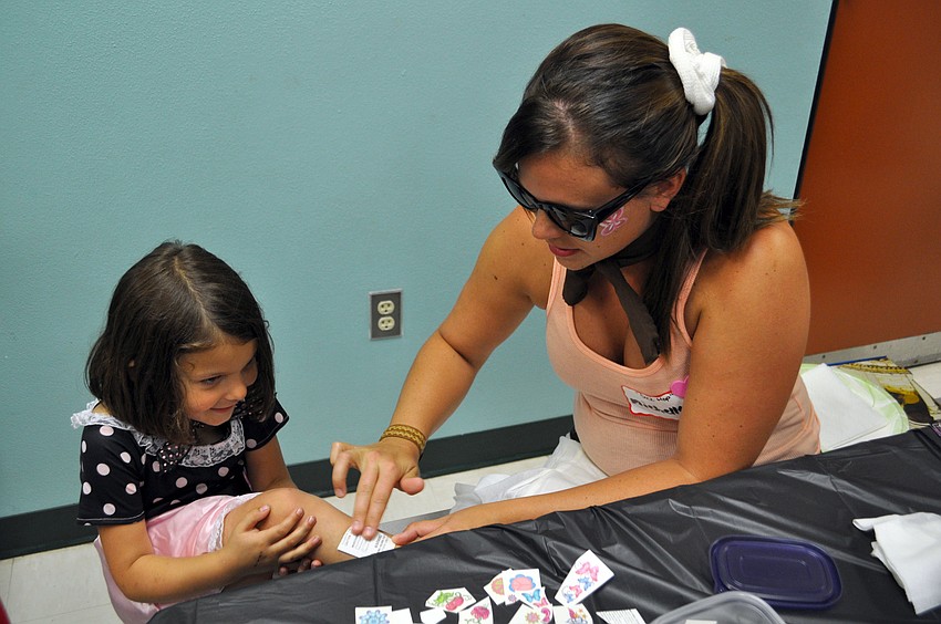 Madison Flinkman gets a tattoo from Michele Frederick