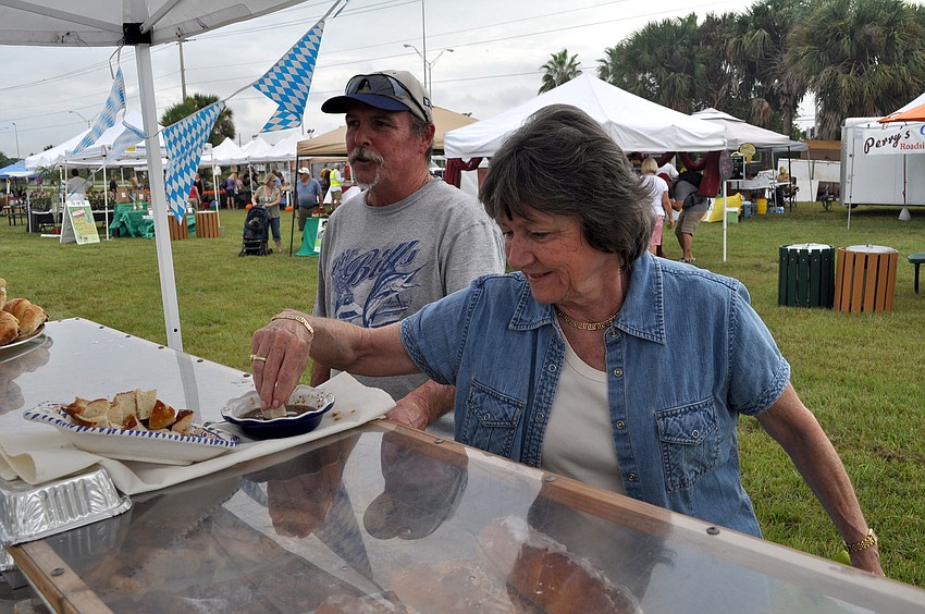 Moira Lavery tries some bread and dip from the European Bakery booth.