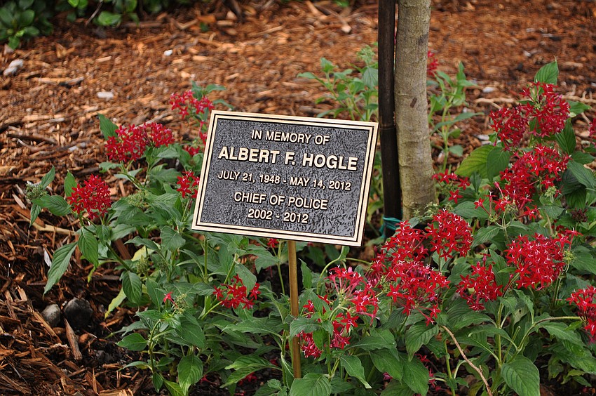 The plaque will be cemented into the ground in front of the cassia fistula tree that was planted in honor of Police Chief Al Hogle.