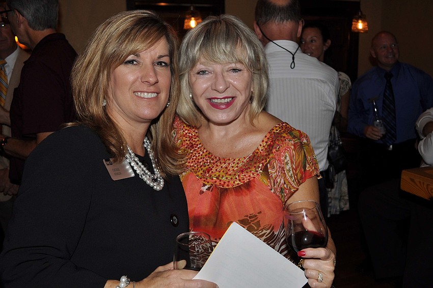 Cherri Kessler, of M&I Bank, with Kimberly Leckie, of Sandals Realty