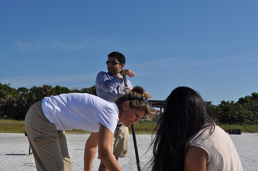 Mohit Gupta takes a break during a 45-minute sand-sculpting lesson at Siesta Key beach.