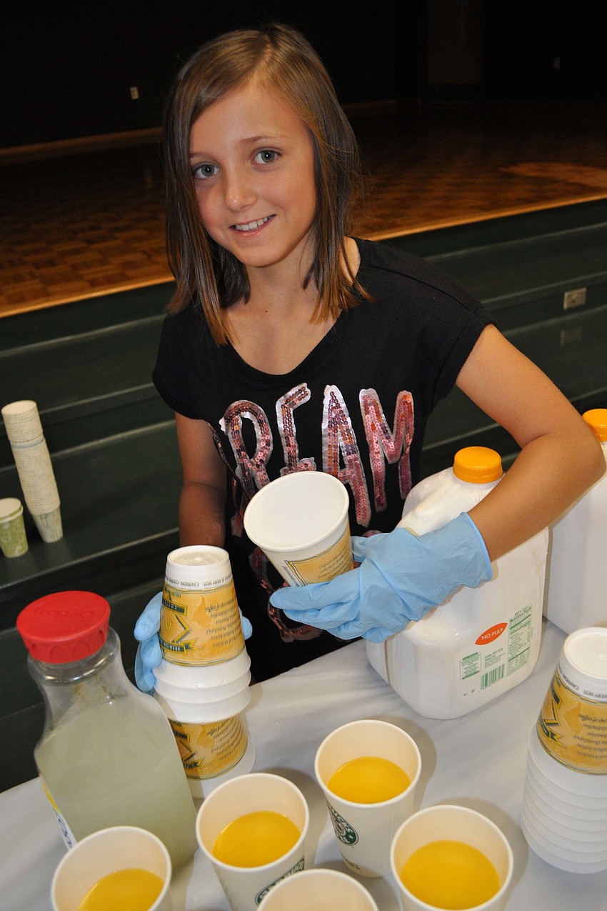 Jordan Higgins, 9, poured drinks for guests.