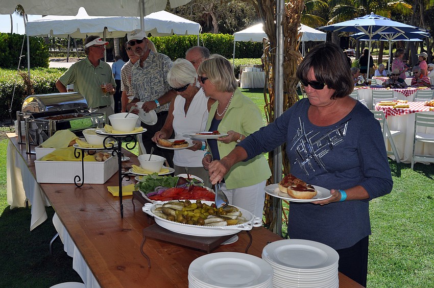 People lined up for burgers, hotdogs and veggie wraps at the Hal and Hazel Lenobel Appreciation Day picnic Sunday, Oct. 21, at the Longboat Key Club Harbourside.