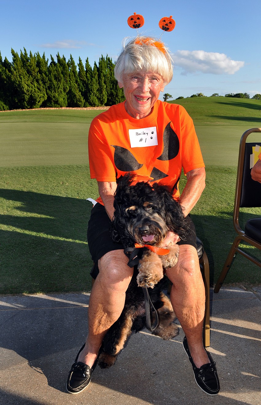 Doris Collins and her dog Bailey, 2, got into the pumpkin spirit of Halloween Monday, Oct. 22, for the 2nd annual Halloween Doggie Parade at Stoneybrook Golf and Country Club in Palmer Ranch.
