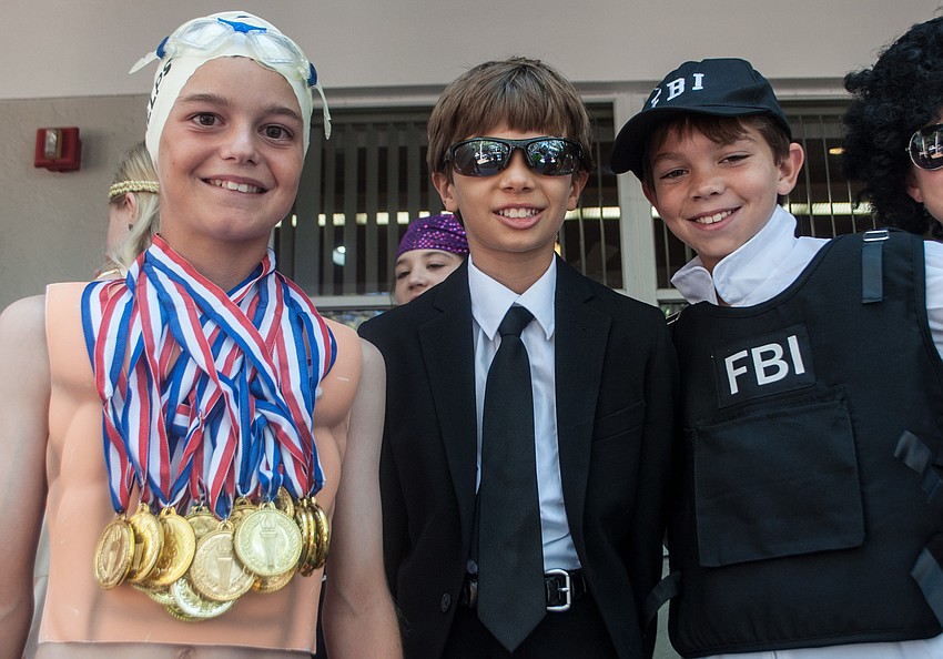 Connor Krug dressed as Olympic Swimmer Michael Phelps, Hayden Bizick came as Men in Black and Tyler Beasley was the FBI.