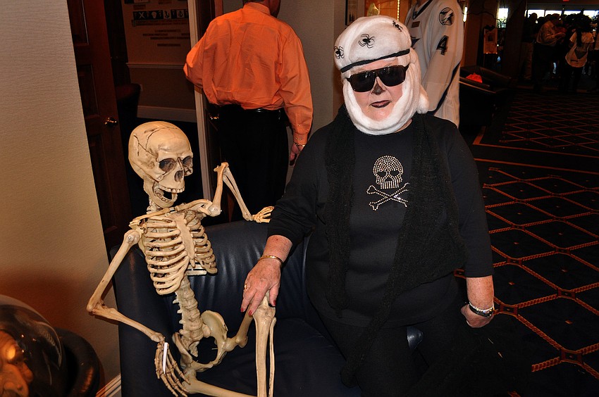 Jeri Cushman poses with a skeleton Wednesday, Oct. 31, at Bird Key Yacht Club.