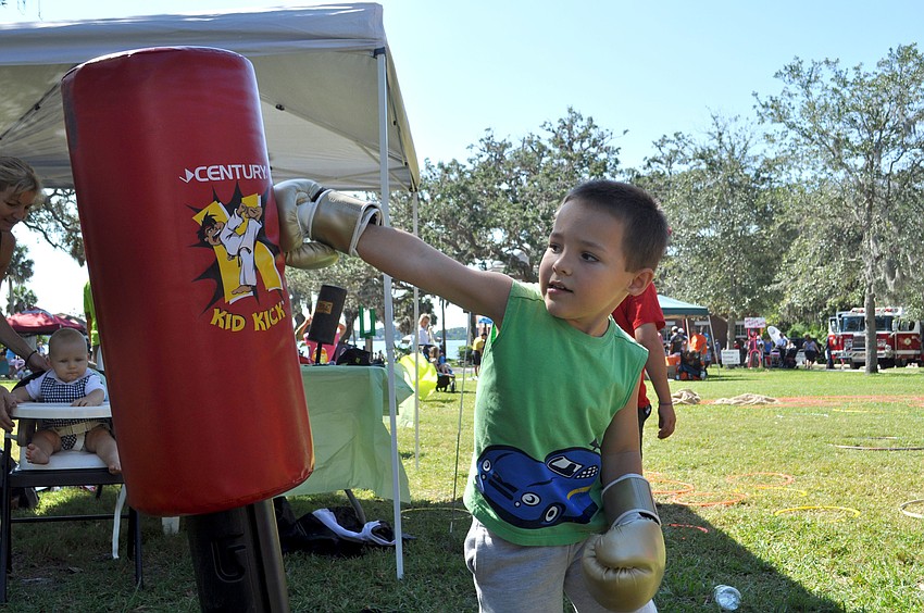 Joseph Grossi punches a punching bag at the fitness station.