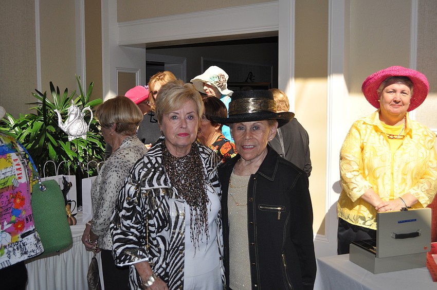 Jane Myers and Doris Caplin, who won her hat at a golf tournament
