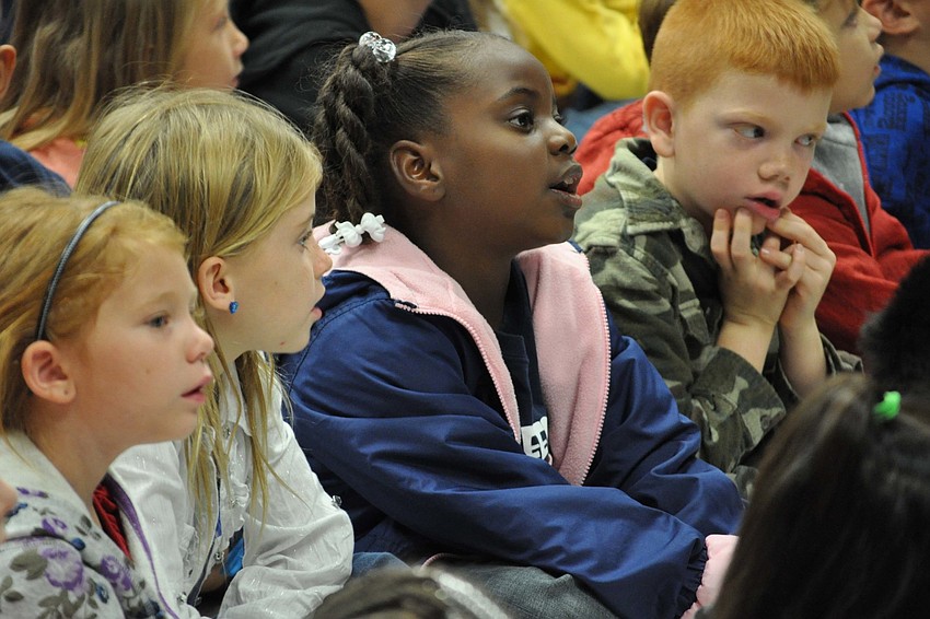 Veteran Billy Coffey got help from Freedom students with raising the U.S. Armyâ€™s flag.