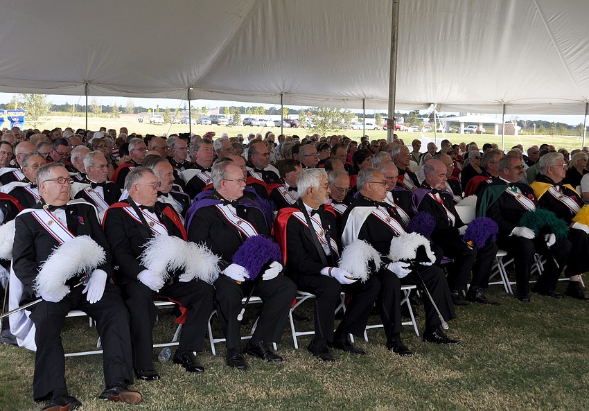 Knights of Columbus members watch during mass.