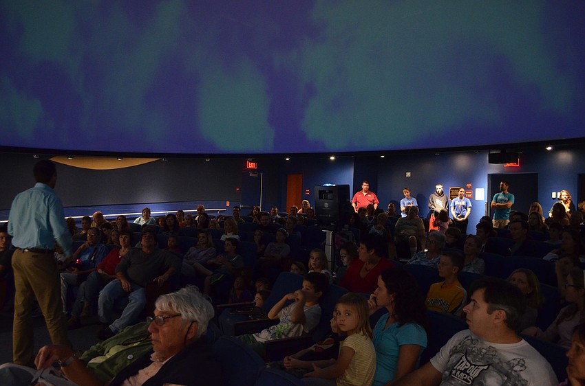 Planetarium Director and astronomy teacher Jason Mocherman talks to the audience about the film.