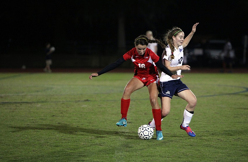 Cardinal Mooney's Rose Amato, No. 16, and ODA's Emily Camire, No. 12 fight for the ball.