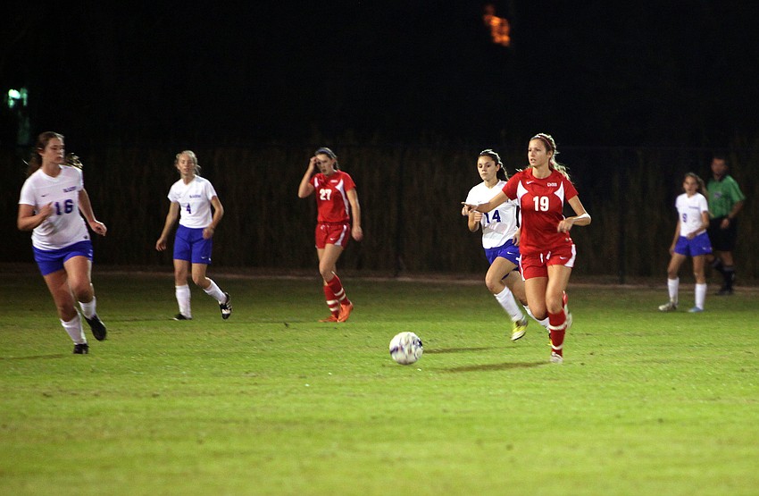 Cardinal Mooneyâ€™s Sam Savinsky, No. 19, kicks the ball up the field Monday, Nov. 26, at Sarasota Christian.