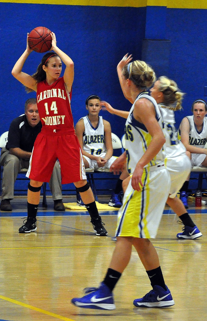 Cardinal Mooneyâ€™s Emily Reonca, No. 14, looks for an open teammate.