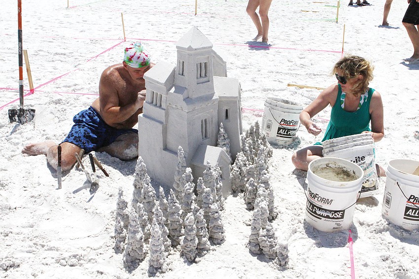 Ken Shields and Mollie Morgan work on their piece, 