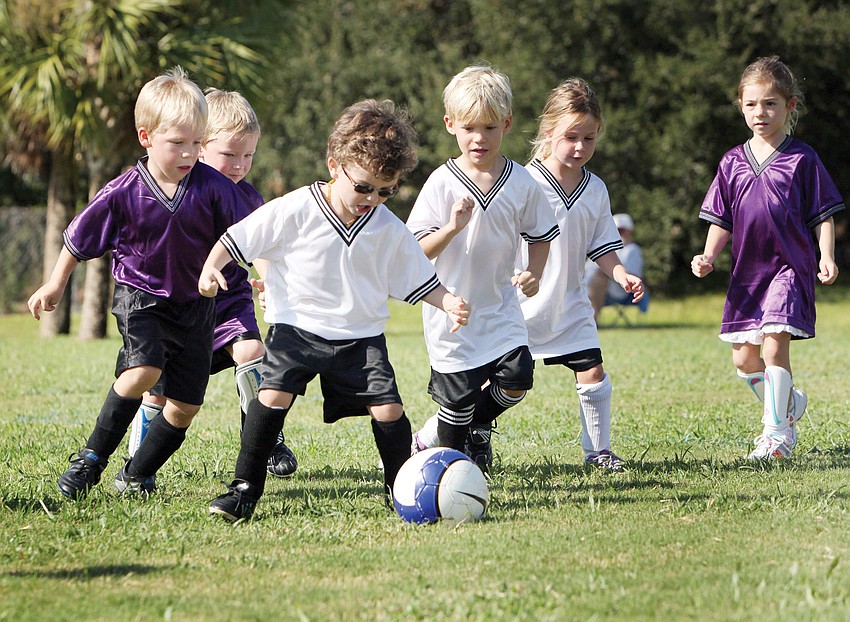 Brennan Abott, third from left, gets control of the ball Saturday, Sept. 8, at Glebe Park for the first weekend of the Suncoast Sports Club season.