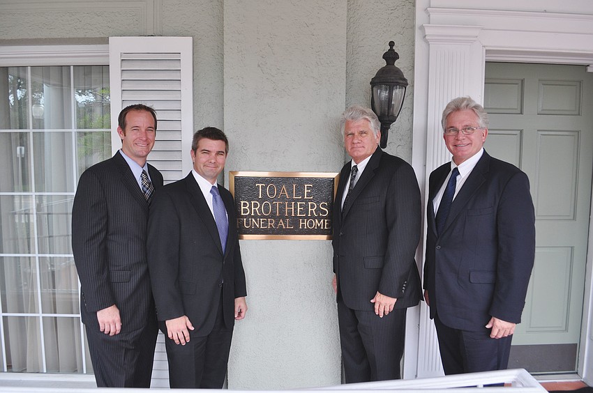 Brothers and third-generation owners Jeff and Jason Toale, with second generation owners Robert and Curt Toale at the Orange Avenue location.