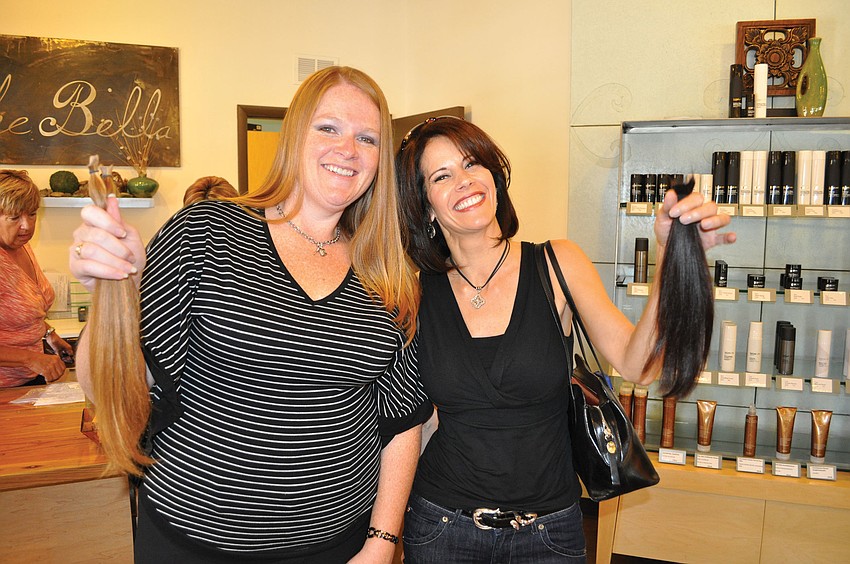 Lakewood Ranch Town Hall employees Marie Thompson and Tara Wagner were thrilled to donate their hair to Locks of Love March 16. Published March 22, 2012.