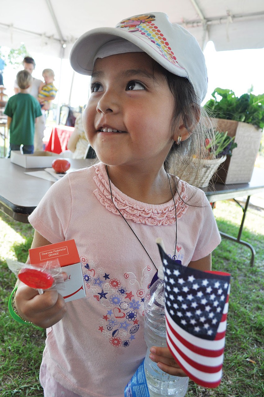 Samantha Resza, 4, enjoyed looking around, during the Spring into Health event April 26, at Bennett Park. Published May 3, 2012.