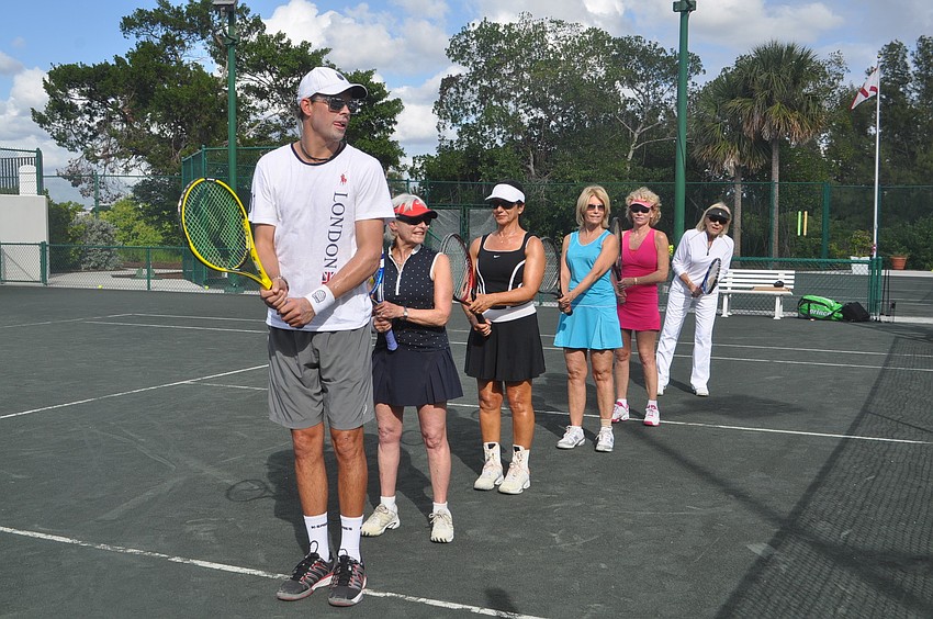 Lana Dormant, Jeri Drucker, Karen Rises, Lane Smallheiser and Joyce Kolligan line up behind Bob Bryan, their team leader for a doubles drill.