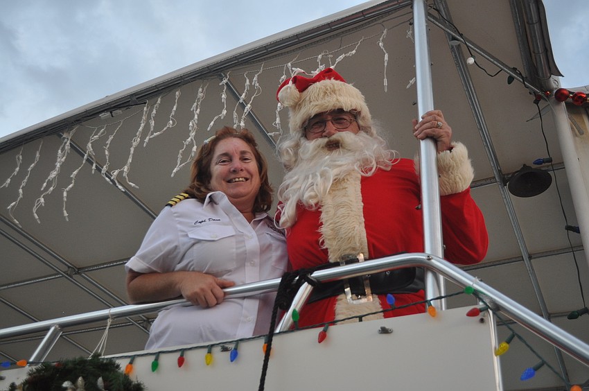 Capt. Dana Whitton with Robby Hensler, one of the partyâ€™s two Santas.