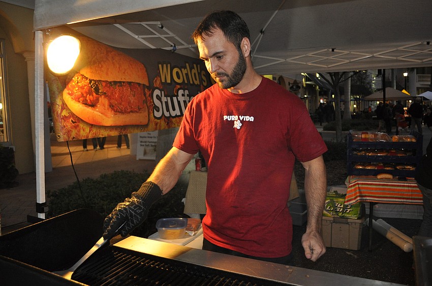 Matt Holt served hamburgers from Full Belly Stuffed Burgers.