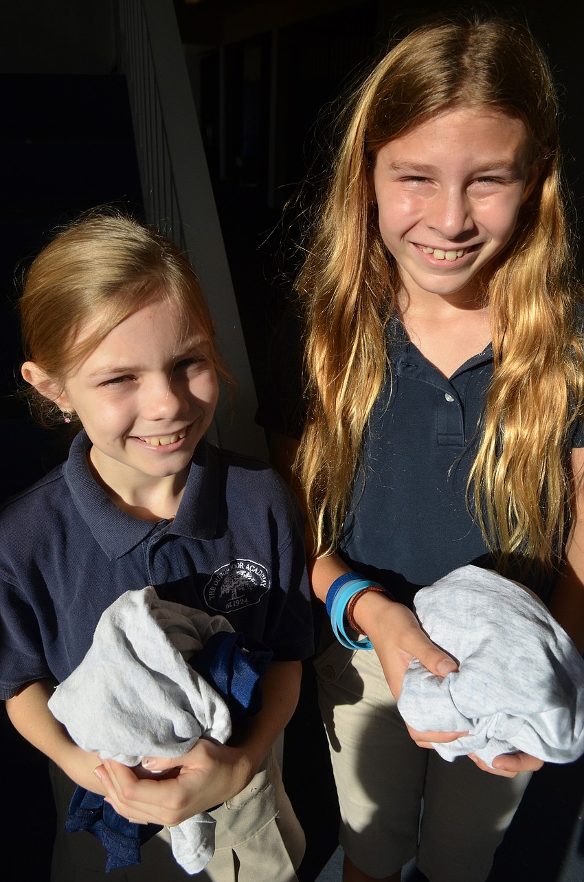Chelsea Ball and Shelby Fulton changed back into their school uniforms after gym at the new Wellness Center girls changing room.