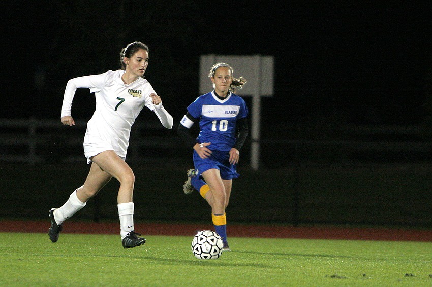 St. Stephenâ€™s Kristi Jones, No. 7, runs the ball down the field as     Sarasota Christianâ€™s Emma Kral, No. 10, tries to catch up.
