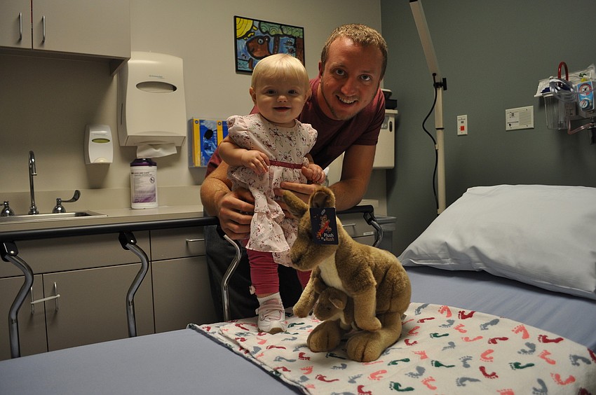 Brian Prete and his nine-month-old daughter, Kahlan, in a treatment room