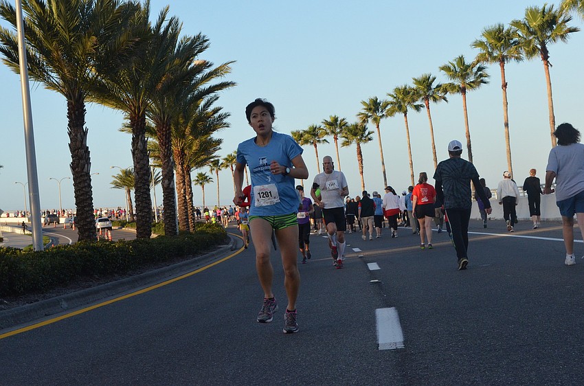 Kristine Koo races down Ringling Bridge.