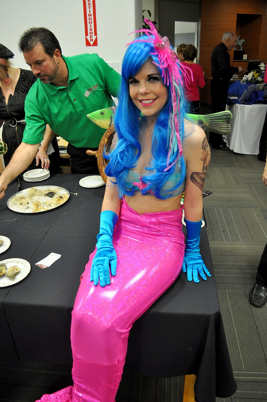 Virginia Hughes dressed as a mermaid for the Half Shell Oyster House.