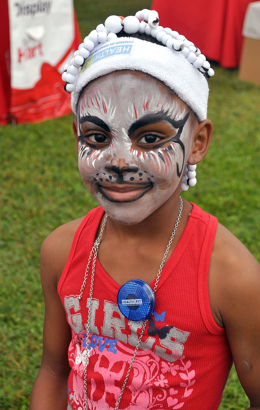 Miajah Davis, 7, had her face painted at the Heart Walk.