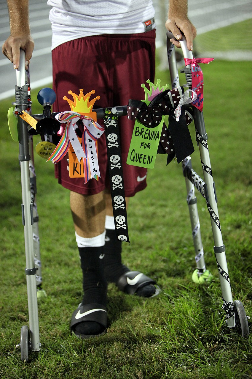 Chase Fisher, No. 45, was severely hurt during the Braden River versus North Port game and is using a walker to get around. Haywood is on the Homecoming court and the Varsity cheerleaders decorated his walker.
