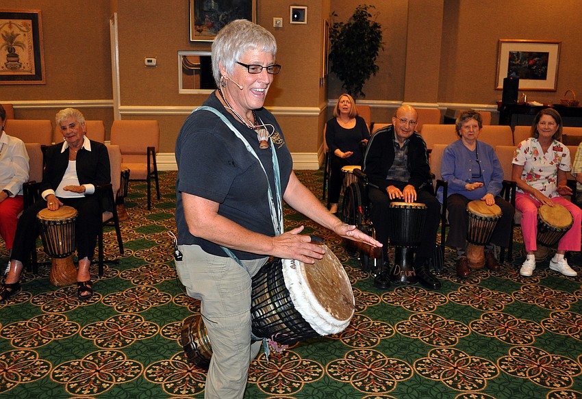 Jana Broder of Drum Magic leads residents of the Sarasota Bay Club in a fun drum circle event Monday, Sept. 24.