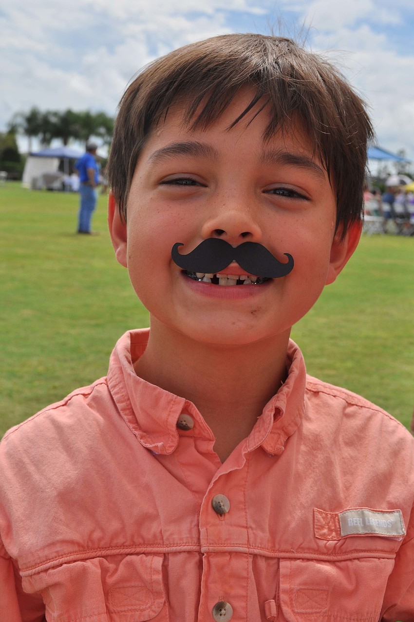 Diego Davila, 8, couldnâ€™t resist getting an Italian-inspired mustache.