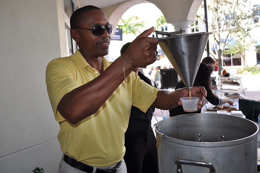 The Polo Grill's Victor Damper poured samples of Maine lobster bisque.