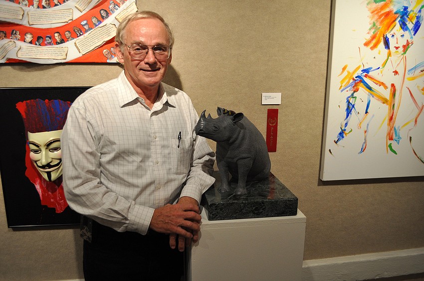 Michael Jenigan with his piece â€œRINO â€“ Republican In Name Onlyâ€, which won second place in the Itâ€™s Political! exhibition.