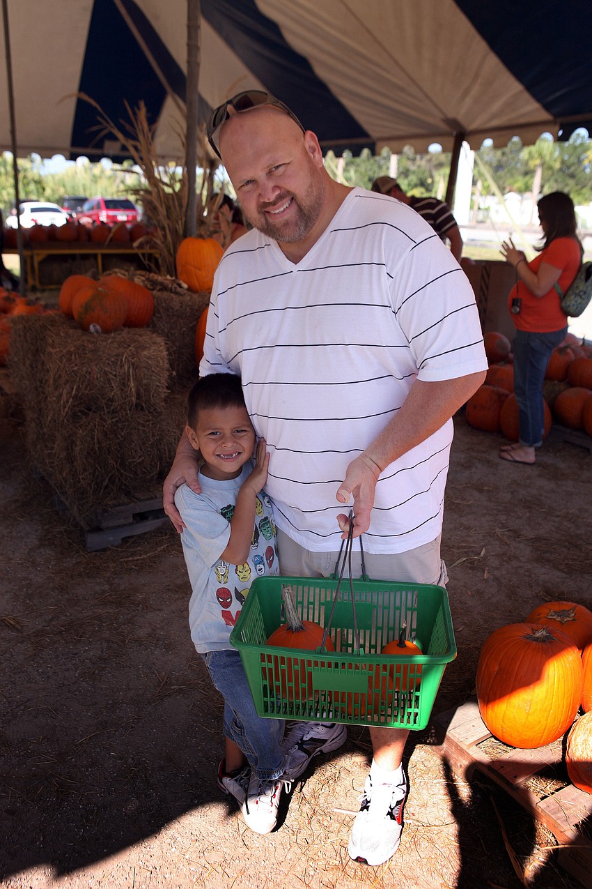 Jacob, 5, and Mike Kress pick out some pumpkins to take home.