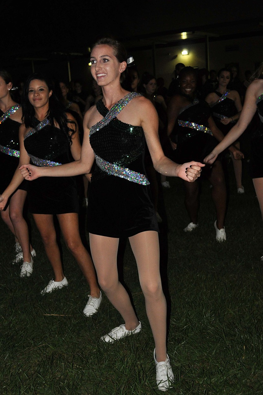 Brooke Ellery, 17, and the rest of the Color Guard performed during the bonfire Oct. 25.