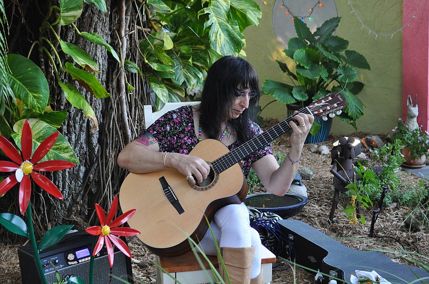 Jimi Gee provides live music.