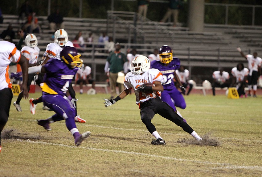 Jalen White, No. 24, tries to out run the Tornadoes.